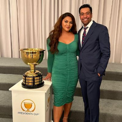 Tony Finau is on a suit and Alayna Finau is wearing a green dress.